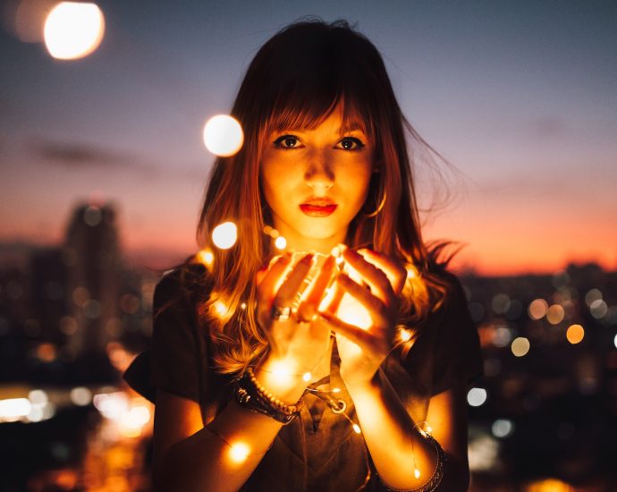 Woman Holding Fireflies