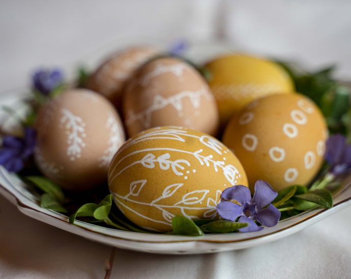 yellow and purple egg on green and white floral ceramic plate
