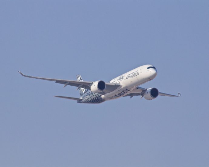 white airplane taking off during daytime