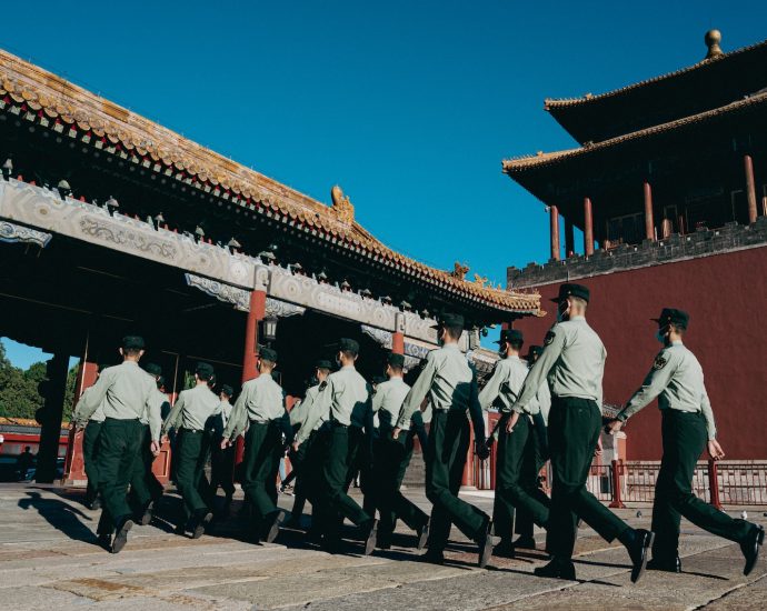 a group of men in uniform walking