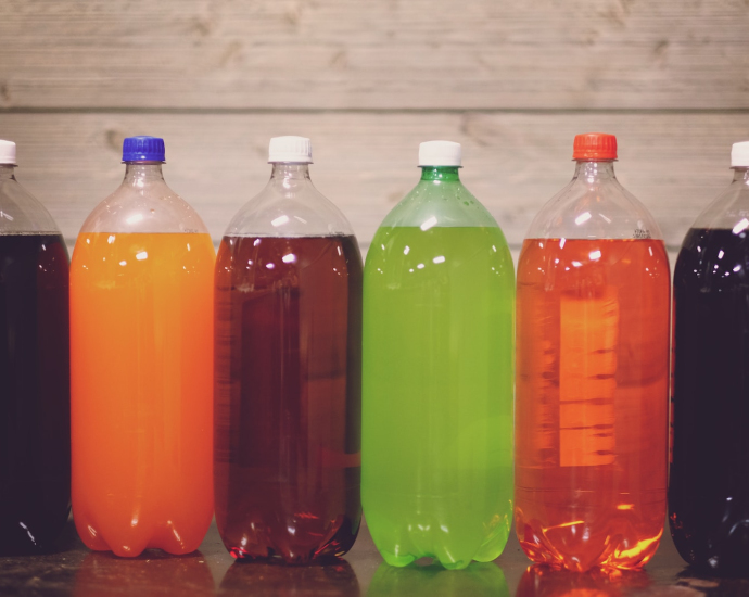 six plastic bottles with assorted-color liquid
