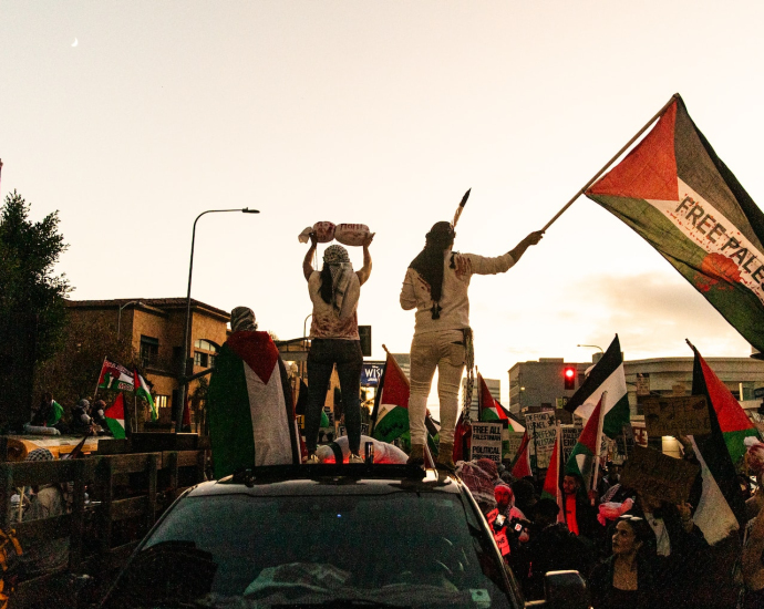 a group of people standing on top of a truck