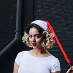 woman standing near gray wall