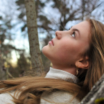 a person with the hair blowing in the wind