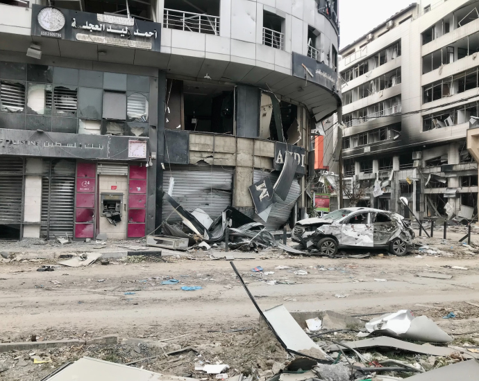 a run down building with a bunch of debris on the ground