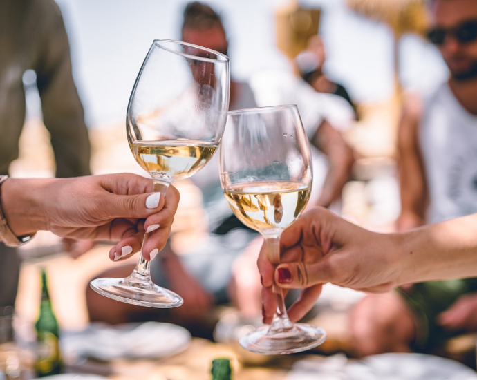 two women holding glass of champagnes