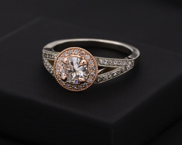 silver diamond ring on black box