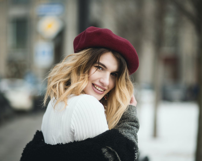 Selective Focus Photography of Smiling Woman Wearing Red Hat during Snowy Day
