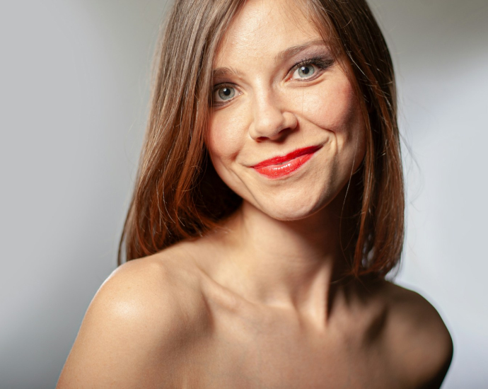 a close up of a woman with a red lipstick