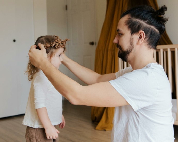 Father Putting Flower Crown to Her Daughter