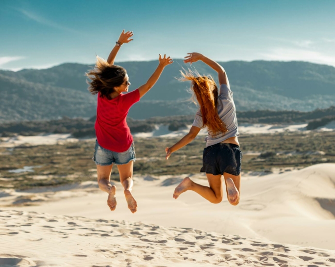 Jump Shot Photography of Two Women