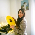 Woman Holding Yellow Vinyl Record