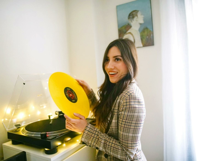 Woman Holding Yellow Vinyl Record