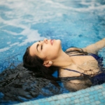 Woman In Blue Bikini On Swimming Pool
