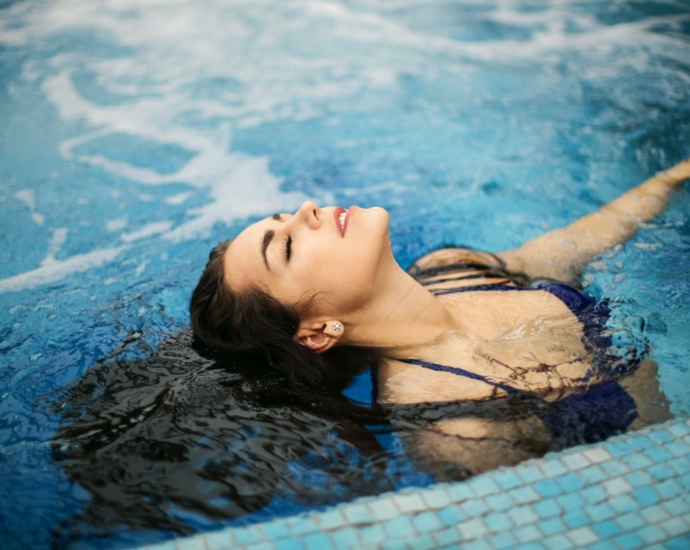 Woman In Blue Bikini On Swimming Pool