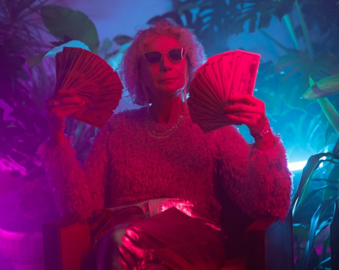 Photo of an Elderly Woman Holding Money