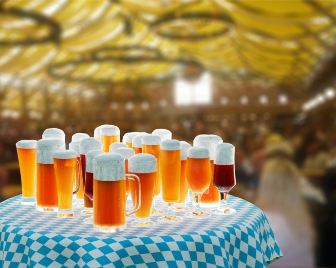 a table topped with lots of glasses of beer