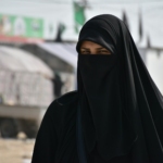 focus photography of women wearing black niqab