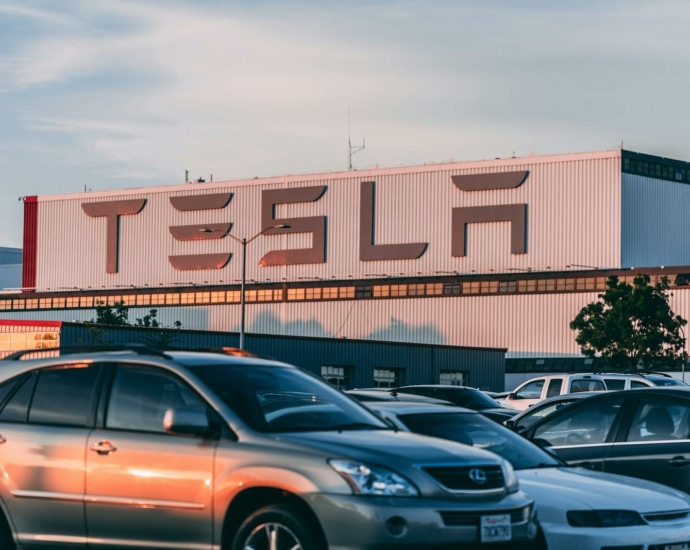 Cars Parked In Front Of Company Building