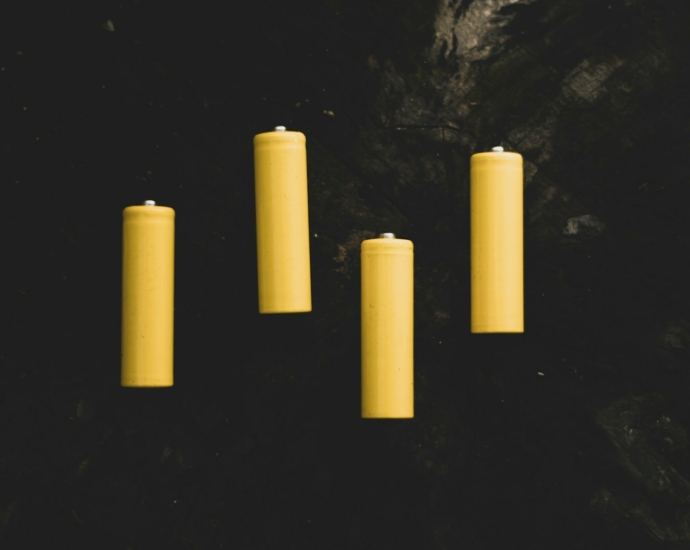 yellow pillar candles on black surface