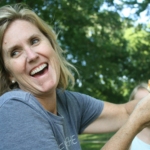 woman holding sandwich