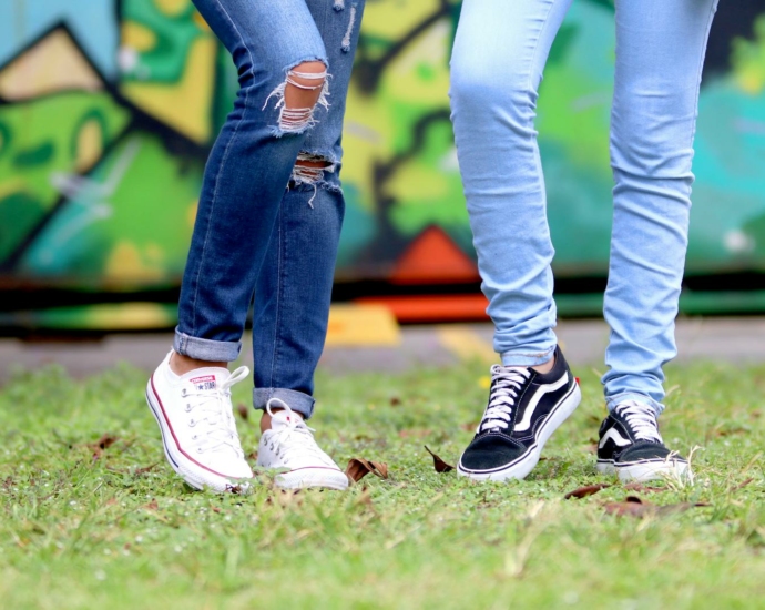 Person's Wearing White and Black Low-top Sneakers