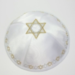 a white hat with a gold star of david on it