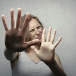 Woman in Gray Tank Top Looking Frightened