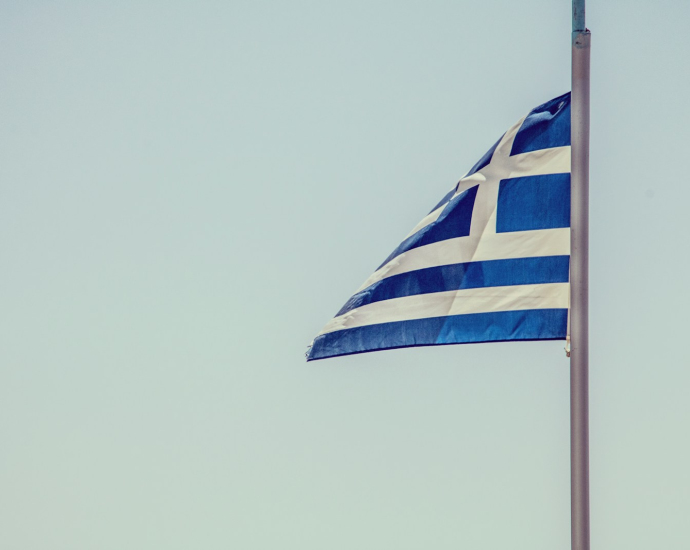 blue and white striped flag on pole