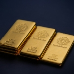 Three gold bars stacked on top of each other