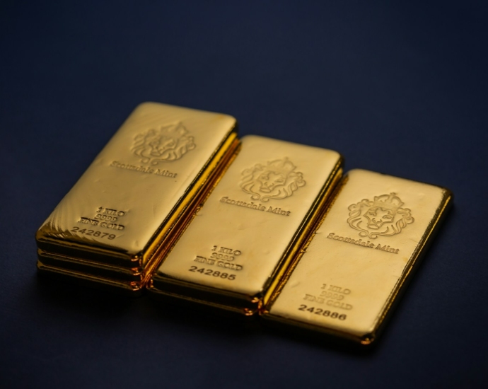 Three gold bars stacked on top of each other