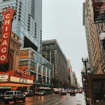 different vehicles on road near Chicago city buildings