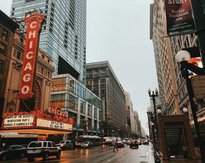 different vehicles on road near Chicago city buildings