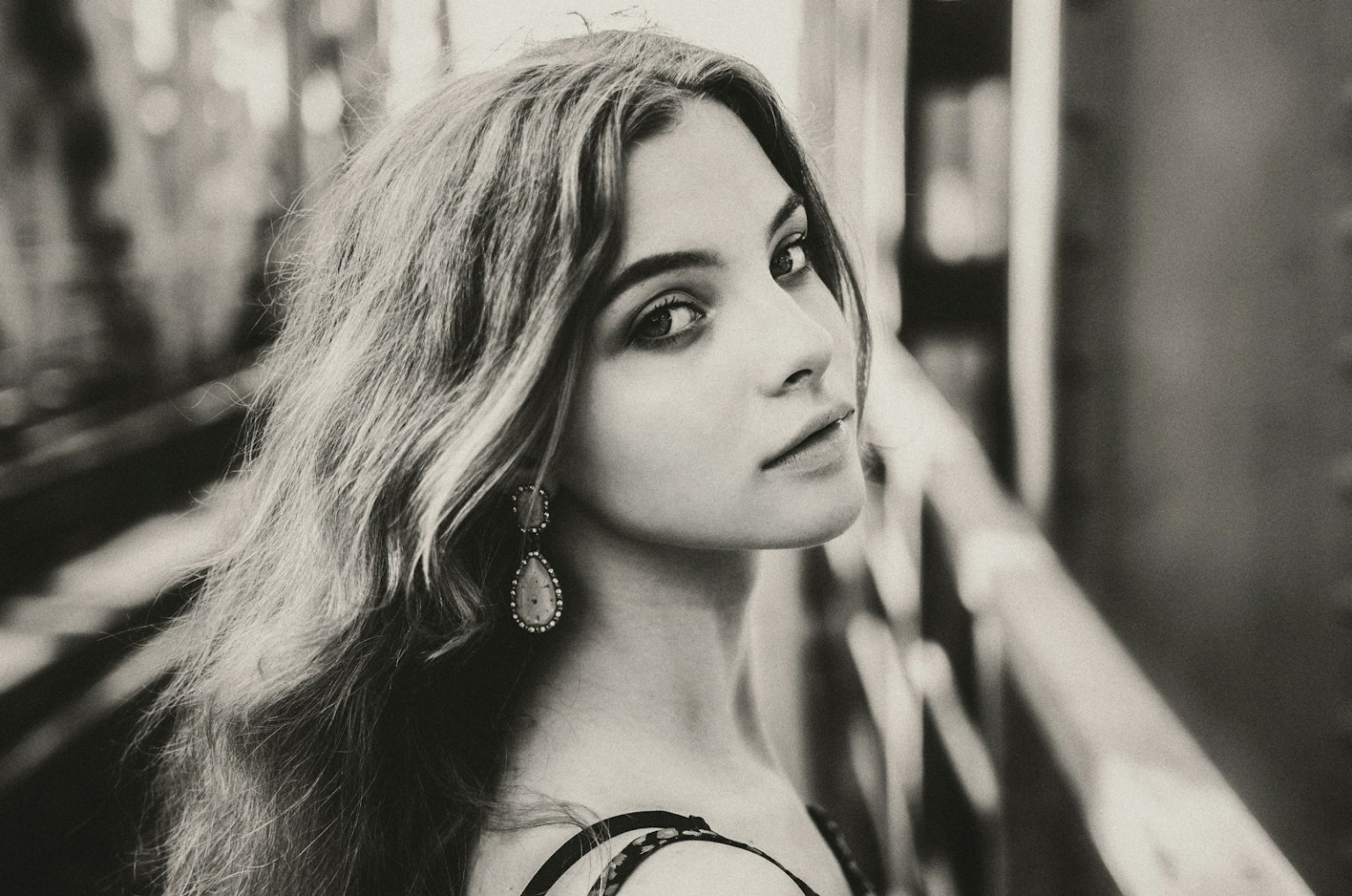 A black and white photo of a woman with long hair