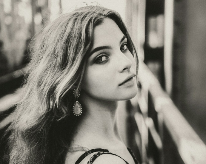 A black and white photo of a woman with long hair