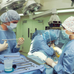 people in blue scrub suit sitting on chair