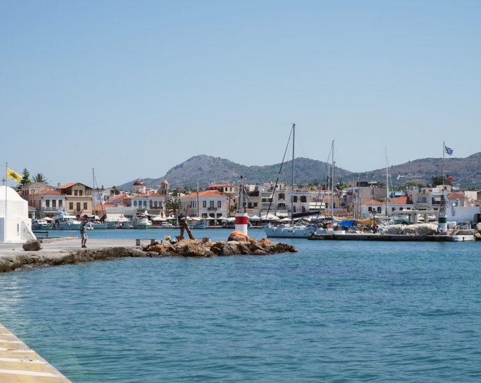 white and blue boat on sea during daytime