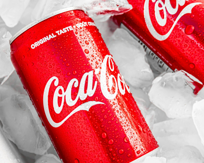 coca cola can on white plastic pack