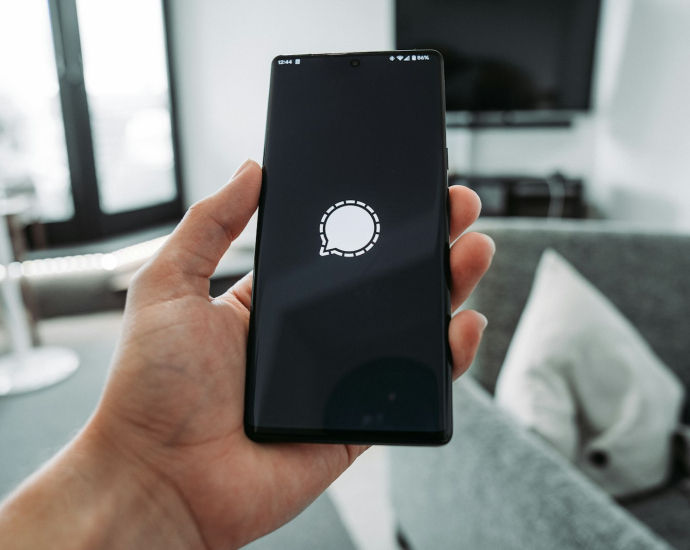 a hand holding a phone