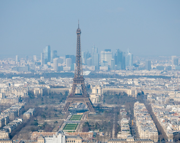 The eiffel tower stands tall over the paris skyline.