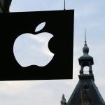 Apple logo in front of a building