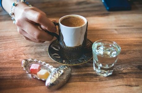 white ceramic cup near mug