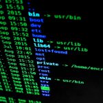 Close-up of colorful text on a computer screen, showcasing cybersecurity concepts.