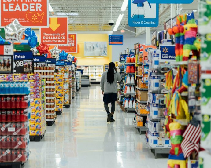 person standing between shelvings