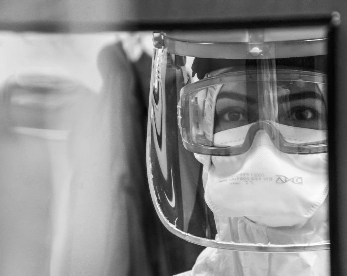 grayscale photo of man wearing goggles