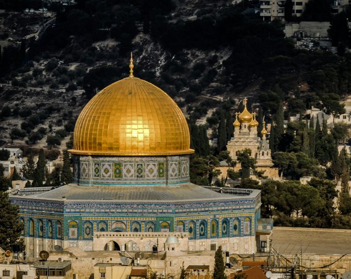 in distant photo of gold and blue temple