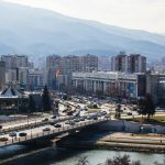 A bustling day in Skopje, North Macedonia, featuring urban architecture and scenic landscape.