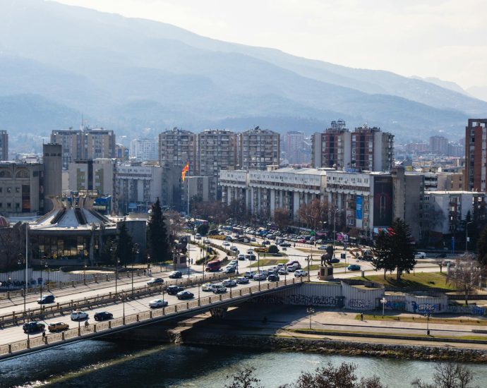 A bustling day in Skopje, North Macedonia, featuring urban architecture and scenic landscape.