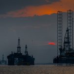 a group of oil rigs in the ocean