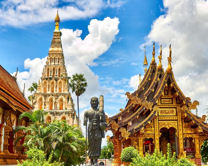 standing statue and temples landmark during daytime
